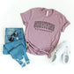 Varsity Surviving Motherhood Short Sleeve Tee