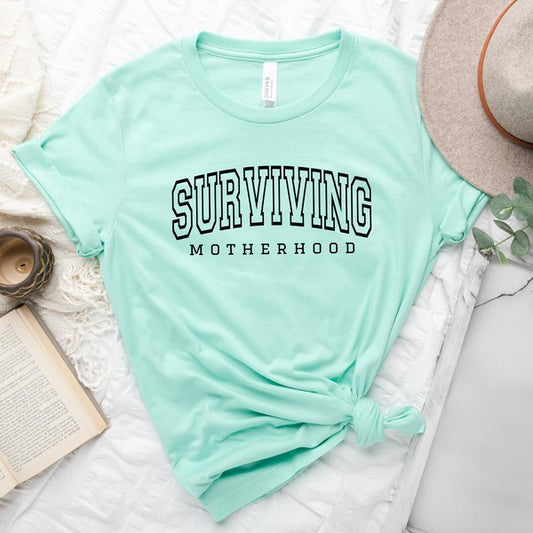 Varsity Surviving Motherhood Short Sleeve Tee